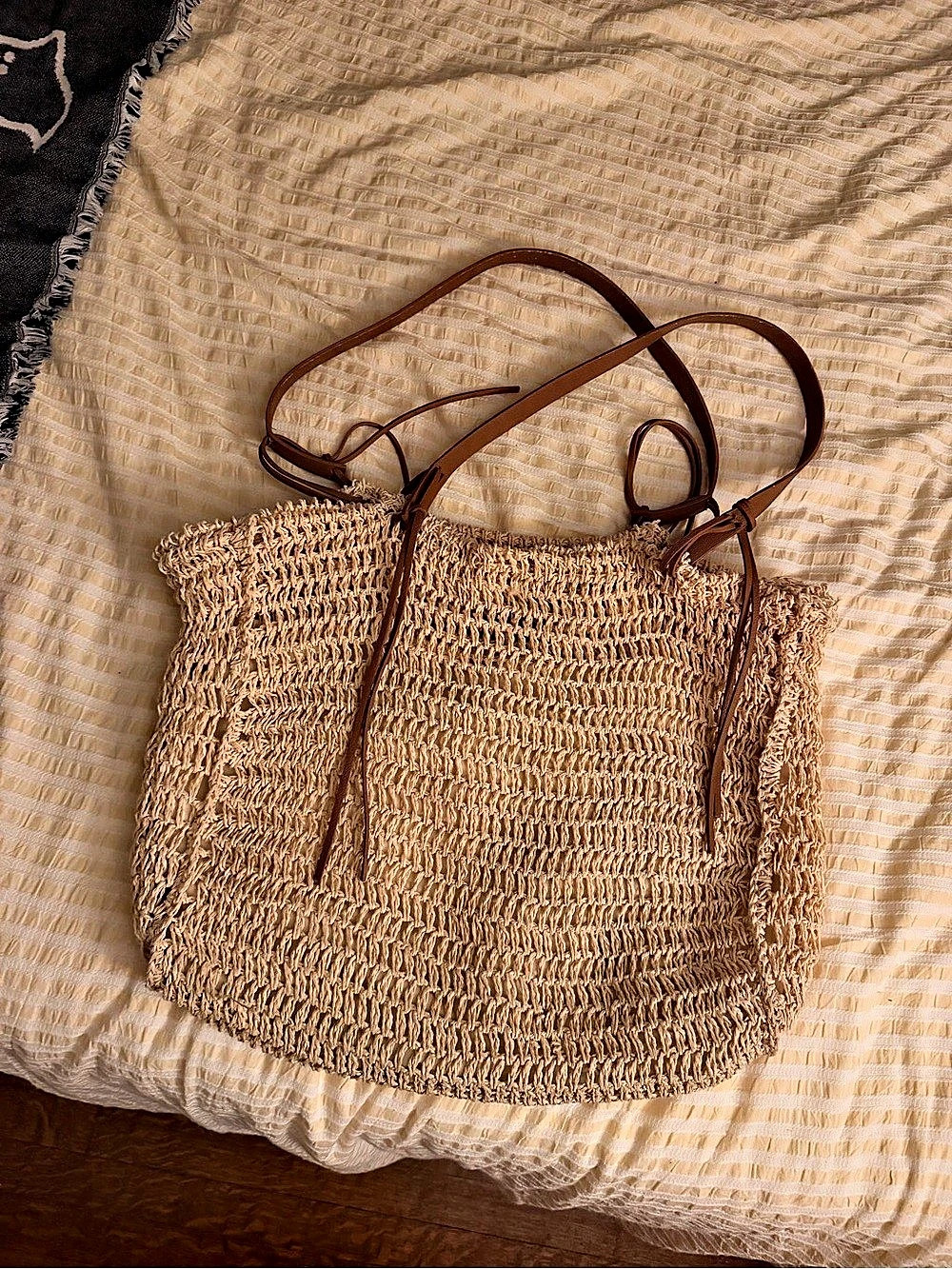 Straw and leather beach bag